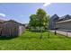 A well-maintained backyard with a lush lawn offers ample space for outdoor activities and relaxation at 238 S 5Th Ave, Beech Grove, IN 46107