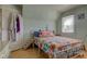 Sunlit bedroom with hardwood floors, cozy decor, and a unique pet stairway at 238 S 5Th Ave, Beech Grove, IN 46107