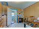 Comfortable bedroom with wood paneled walls, blue trim, and well-placed furnishings at 238 S 5Th Ave, Beech Grove, IN 46107