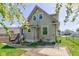 The home's exterior shows a well-kept yard, classic siding, and a charming backyard at 238 S 5Th Ave, Beech Grove, IN 46107