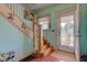 Charming foyer features a staircase, bright walls, and a view of the inviting front porch at 238 S 5Th Ave, Beech Grove, IN 46107