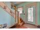 Charming foyer features a staircase, bright walls, and a view of the inviting front porch at 238 S 5Th Ave, Beech Grove, IN 46107
