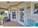 Inviting front porch with comfortable seating and ample space to relax and enjoy the neighborhood at 238 S 5Th Ave, Beech Grove, IN 46107