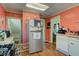 Spacious kitchen with modern appliances, wood floors, and plenty of storage at 238 S 5Th Ave, Beech Grove, IN 46107