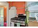 Kitchen showcasing a modern gas range and hood with bright lighting and neutral colors at 238 S 5Th Ave, Beech Grove, IN 46107