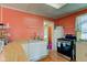 Well-lit kitchen features wood floors, ample countertop space, and modern appliances at 238 S 5Th Ave, Beech Grove, IN 46107