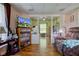 Comfortable living room with a TV, hardwood floors, and a view into another room at 238 S 5Th Ave, Beech Grove, IN 46107