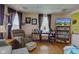 Cozy living room with hardwood floors, comfortable seating, and ample natural light at 238 S 5Th Ave, Beech Grove, IN 46107