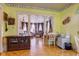 Open floor plan showcases an inviting living space with hardwood floors and neutral paint tones at 238 S 5Th Ave, Beech Grove, IN 46107