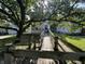 Exterior of house featuring a wooden ramp leading to front door, shaded by a large tree at 2509 S New Jersey St, Indianapolis, IN 46225