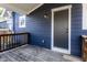 Back porch area with wood decking and navy blue siding at 2954 N Washington Blvd, Indianapolis, IN 46205