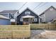 Backyard view of a dark blue house with a wood privacy fence at 2954 N Washington Blvd, Indianapolis, IN 46205