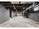 Unfinished basement with exposed ceiling and ductwork ready for customization at 2954 N Washington Blvd, Indianapolis, IN 46205