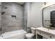 Beautiful bathroom features a shower-tub combination with gray tiling and a vanity with sink at 2954 N Washington Blvd, Indianapolis, IN 46205