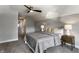 Cozy bedroom with carpeted floors, a ceiling fan, and a queen bed at 2954 N Washington Blvd, Indianapolis, IN 46205