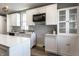 Bright kitchen features white cabinetry, stainless steel appliances, and a kitchen island with quartz countertop at 2954 N Washington Blvd, Indianapolis, IN 46205