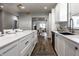 Contemporary kitchen with a large island, white cabinets, and modern fixtures at 2954 N Washington Blvd, Indianapolis, IN 46205