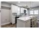 Modern kitchen featuring white cabinetry, quartz countertops, and stainless steel appliances at 2954 N Washington Blvd, Indianapolis, IN 46205