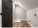Compact laundry room with wood-look floors and gray walls at 2954 N Washington Blvd, Indianapolis, IN 46205
