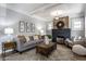Cozy living room featuring a decorative fireplace, exposed brick, and neutral décor at 2954 N Washington Blvd, Indianapolis, IN 46205
