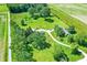An aerial view shows several structures on the property, surrounded by trees and well-maintained grounds at 3001 W 226Th St, Sheridan, IN 46069