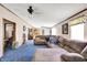 Cozy living room with plush sectional sofa, blue carpet, and ample space for relaxation and entertainment at 3001 W 226Th St, Sheridan, IN 46069