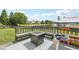 Backyard deck with firepit, bench seating and fun activities for children and serene lake views at 301 Cobblesprings Ct, Avon, IN 46123