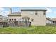Home's backyard has a spacious deck for entertaining and enjoying the lush lawn at 301 Cobblesprings Ct, Avon, IN 46123