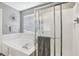 A clean bathroom with a large tub, a tiled walk-in shower, and natural light at 301 Cobblesprings Ct, Avon, IN 46123