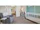 Inviting Bedroom space with a comfortable glider, colorful toys, and a cozy crib at 301 Cobblesprings Ct, Avon, IN 46123