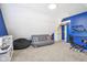 A vibrant bonus room featuring a futon, game chair, and plenty of room for activities at 301 Cobblesprings Ct, Avon, IN 46123