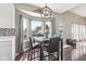 Charming breakfast nook featuring a table with seating for four, a view to the outdoors, and modern lighting at 301 Cobblesprings Ct, Avon, IN 46123