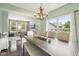 Bright dining area with views to the backyard and living room, featuring a wooden table with bench seating at 301 Cobblesprings Ct, Avon, IN 46123