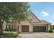 Charming home featuring a brick and vinyl exterior with a spacious three-car garage and well-maintained lawn at 301 Cobblesprings Ct, Avon, IN 46123
