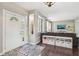Inviting foyer with hardwood floors, decorative niche, and view into the living room at 301 Cobblesprings Ct, Avon, IN 46123