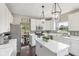 Bright eat-in kitchen with stainless steel appliances, modern white cabinetry, and plenty of countertop space at 301 Cobblesprings Ct, Avon, IN 46123