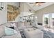 Spacious living room with vaulted ceilings and a large sectional sofa, perfect for relaxing and entertaining at 301 Cobblesprings Ct, Avon, IN 46123