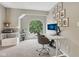 Bright home office with a large window, desk, and shelving for organized productivity at 301 Cobblesprings Ct, Avon, IN 46123