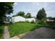 Spacious backyard with two garages and potential for outdoor activities and gardening at 320 N Colorado Ave, Indianapolis, IN 46201