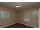 Bedroom with drab walls, blinds and neutral carpeting at 320 N Colorado Ave, Indianapolis, IN 46201