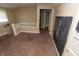 A bedroom with carpet and an open door to a bathroom at 320 N Colorado Ave, Indianapolis, IN 46201