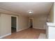 Spacious living room featuring hardwood floors and a cozy fireplace at 320 N Colorado Ave, Indianapolis, IN 46201
