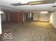 Unfinished basement featuring concrete floors and support beams at 3253 W 34Th St, Indianapolis, IN 46222