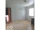 Dining room with tile flooring, bright window, and simple lighting fixture at 3253 W 34Th St, Indianapolis, IN 46222