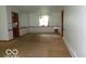 Inviting dining area featuring neutral walls and carpet, ready for your personal touch at 3253 W 34Th St, Indianapolis, IN 46222