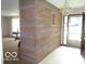 Bright entryway featuring a unique stone wall and chandelier at 3253 W 34Th St, Indianapolis, IN 46222