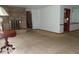Open-concept living room featuring a fireplace at 3253 W 34Th St, Indianapolis, IN 46222