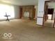 Open living room with stone fireplace at 3253 W 34Th St, Indianapolis, IN 46222
