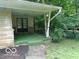 Inviting covered porch with stone accents and peaceful surroundings at 3253 W 34Th St, Indianapolis, IN 46222