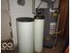 Close up shot of the water softener and hot water heater in the basement at 3253 W 34Th St, Indianapolis, IN 46222